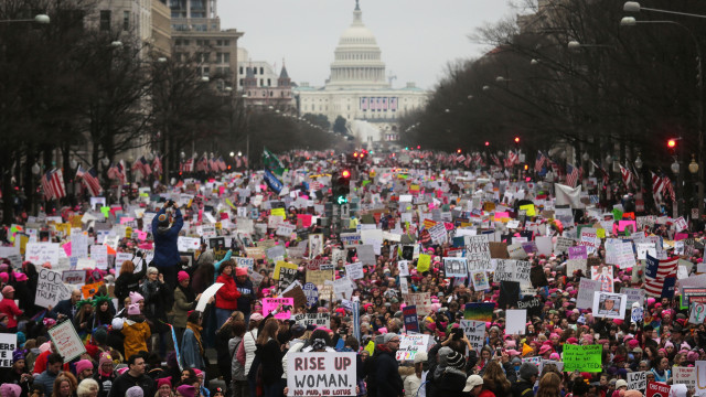WASHINGTON, DC - JANUARY 21: Protesters walk during the Women's March on Washington, with the U.S. Capitol in the background, on January 21, 2017 in Washington, DC. Large crowds are attending the anti-Trump rally a day after U.S. President Donald Trump was sworn in as the 45th U.S. president. (Photo by Mario Tama/Getty Images)